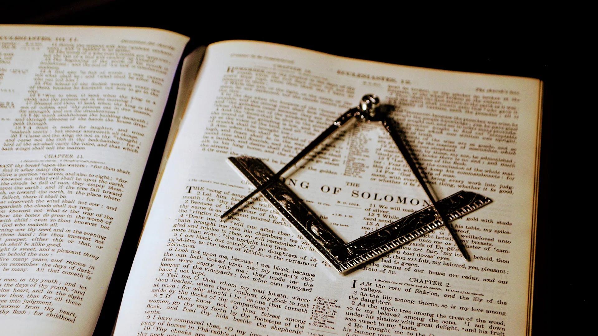 Holy Bible, Square, and Compasses